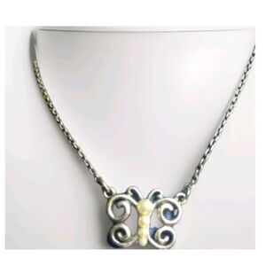 Guess Silvertone stamped butterfly necklace